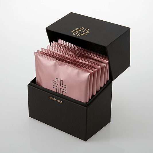 Black box with pink packets inside on a white background