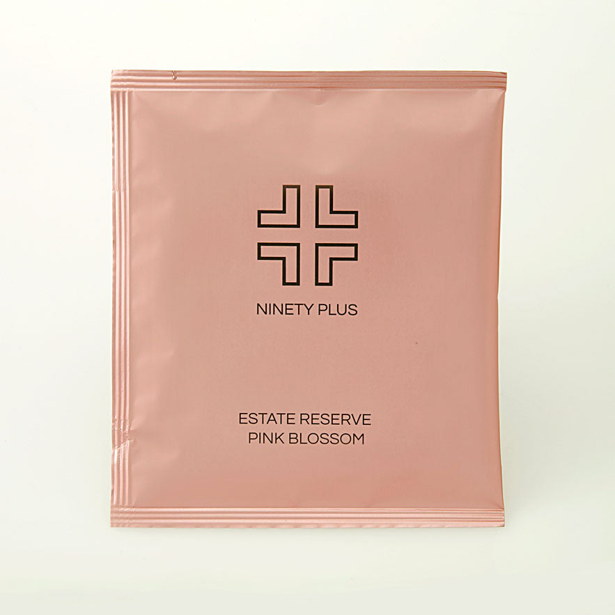 Pink packaging with 'Ninety Plus' branding on a white background