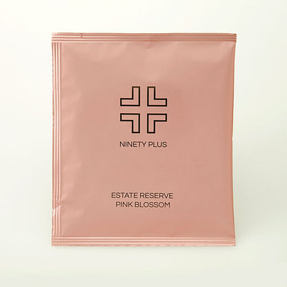 Pink packaging with 'Ninety Plus' branding on a white background