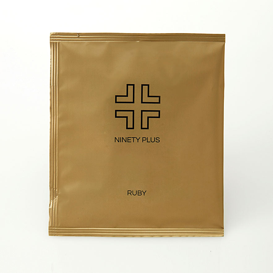 Gold packaging with 'Ninety Plus' logo and 'Ruby' text on a white background